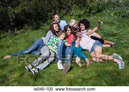 Stock Image - Friends having photo taken. Fotosearch