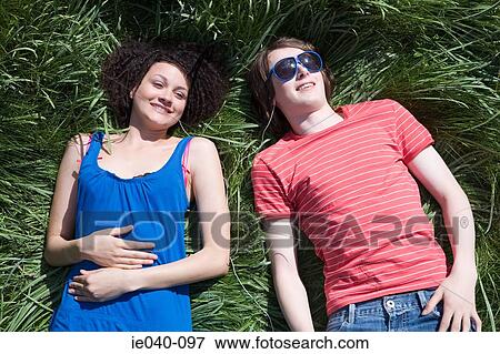 Stock Photo - Friends listening to music. Fotosearch