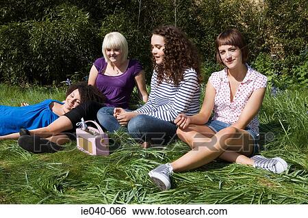 Stock Photograph - Friends listening to radio. Fotosearch