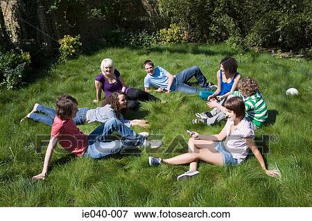 Friends sat in a circle View Large Photo Image Stock Photo - Friends sat in a circle. Fotosearch