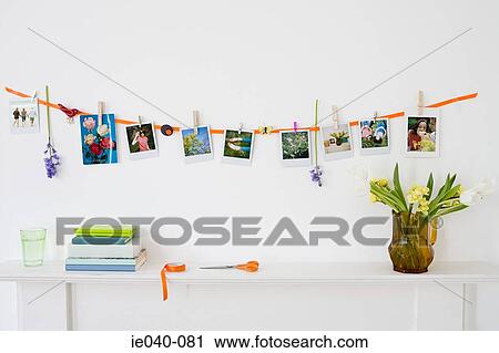 Photographs hanging on a wall View Large Photo Image Stock Image - Photographs hanging on a wall. Fotosearch