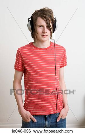 Stock Photograph - Teenage boy listening to music. Fotosearch