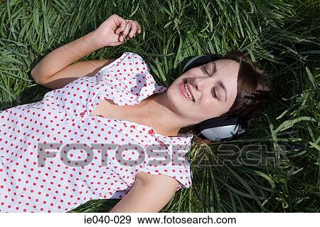 Teenage girl listening to music View Large Photo Image Stock Photo - Teenage girl listening to music. Fotosearch