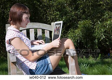 Teenage girl using laptop View Large Photo Image Stock Image - Teenage girl using laptop. Fotosearch