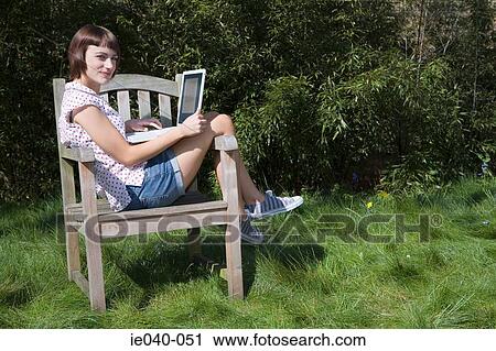 Teenage girl using laptop View Large Photo Image Stock Image - Teenage girl using laptop. Fotosearch
