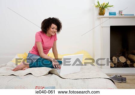 Teenage girl using laptop View Large Photo Image Stock Image - Teenage girl using laptop. Fotosearch