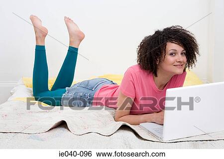 Teenage girl using laptop View Large Photo Image Stock Photograph - Teenage girl using laptop. Fotosearch