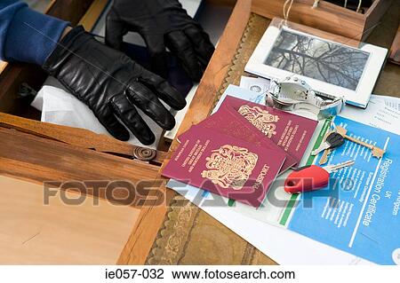 A burglar searching through a drawer View Large Photo Image Stock Image - A burglar searching through a drawer. Fotosearch