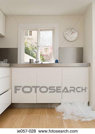 A dishwasher leaking View Large Photo Image Stock Photo - A dishwasher leaking. Fotosearch