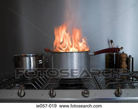 A saucepan on fire View Large Photo Image Stock Photo - A saucepan on fire. Fotosearch