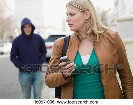 A woman being stalked View Large Photo Image Stock Photograph - A woman being stalked. Fotosearch