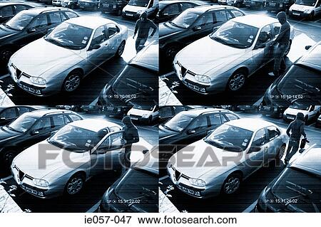 Cctv footage of a thief stealing from a car View Large Photo Image Stock Photo - Cctv footage of a thief stealing from a car. Fotosearch