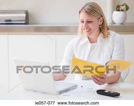 Woman making an insurance claim on the internet View Large Photo Image Stock Photo - Woman making an insurance claim on the internet. Fotosearch