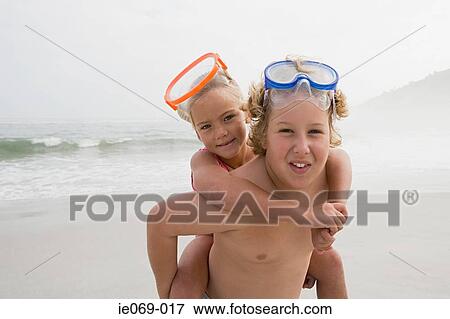 Boy and girl by the sea View Large Photo Image Stock Photo - Boy and girl by the sea. Fotosearch