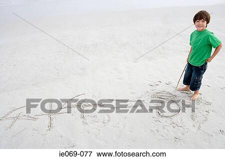 Boy doing mathematics on the beach View Large Photo Image Stock Photo - Boy doing mathematics on the beach. Fotosearch