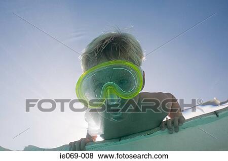 Stock Photo - Boy putting face underwater. Fotosearch