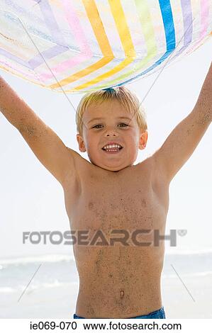 Boy with a beach ball View Large Photo Image Stock Image - Boy with a beach ball. Fotosearch