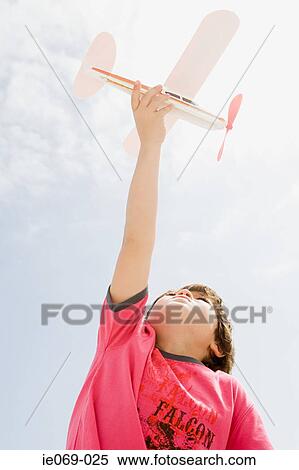 Boy with toy aeroplane View Large Photo Image Stock Photography - Boy with toy aeroplane. Fotosearch