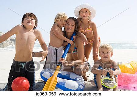 Stock Photo - Family at the beach. Fotosearch