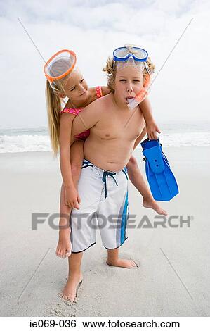 Girl and boy on beach View Large Photo Image Stock Photograph - Girl and boy on beach. Fotosearch