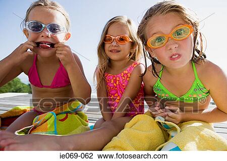 Stock Image - Girls making faces. Fotosearch
