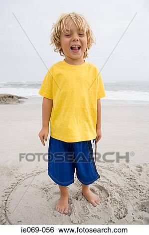 Happy boy on a beach View Large Photo Image Stock Photograph - Happy boy on a beach. Fotosearch