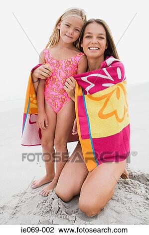 Mother and daughter at beach View Large Photo Image Stock Image - Mother and daughter at beach. Fotosearch