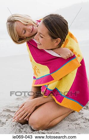 Stock Image - Mother and daughter in a towel. Fotosearch