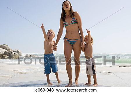 Mother and sons at the beach View Large Photo Image Stock Photo - Mother and sons at the beach. Fotosearch
