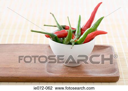 Chill peppers in a bowl View Large Photo Image Stock Image - Chill peppers in a bowl. Fotosearch