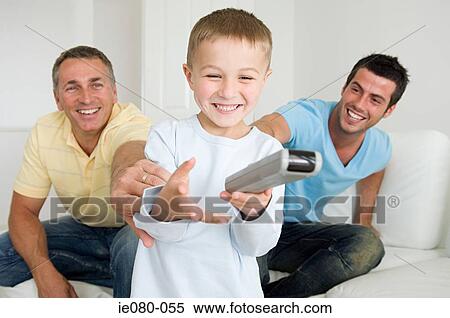 Boy using a remote control View Large Photo Image Stock Photography - Boy using a remote control. Fotosearch