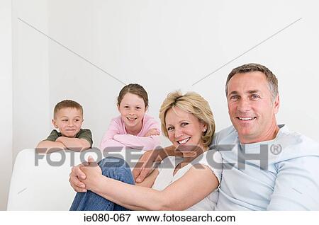 Family on a sofa View Large Photo Image Stock Photo - Family on a sofa. Fotosearch