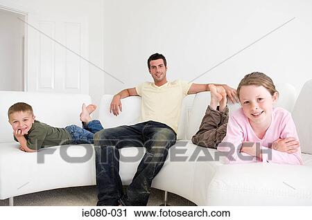Father with children on sofa View Large Photo Image Stock Image - Father with children on sofa. Fotosearch