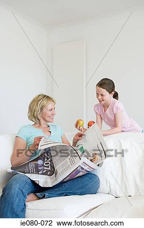 Mother and daughter in living room View Large Photo Image Stock Image - Mother and daughter in living room. Fotosearch