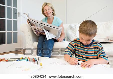 Mother and son in the living room View Large Photo Image Picture - Mother and son in the living room. Fotosearch