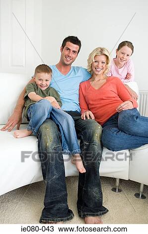 Stock Image - Portrait of a young family. Fotosearch
