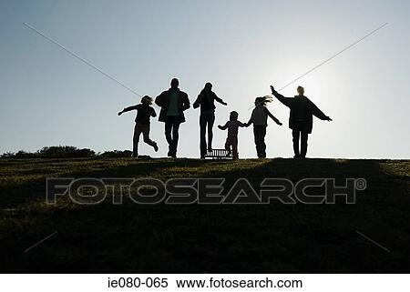 Silhouetted family View Large Photo Image Stock Photography - Silhouetted family. Fotosearch