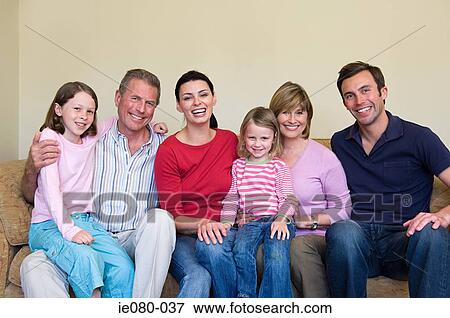 Stock Photo - Three generation family on sofa. Fotosearch
