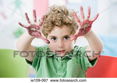 A boy with paint on his hands View Large Photo Image Stock Photo - A boy with paint on his hands. Fotosearch