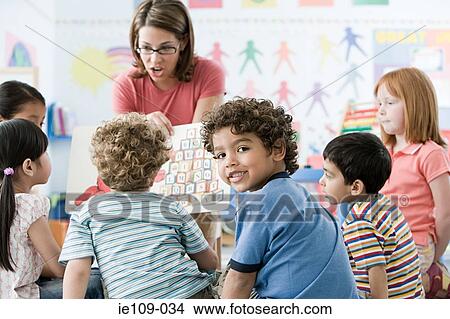 Picture - A teacher with children. Fotosearch