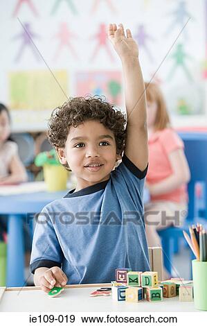 Boy raising arm View Large Photo Image Stock Photo - Boy raising arm. Fotosearch