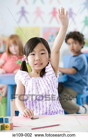 Girl raising arm View Large Photo Image Stock Image - Girl raising arm. Fotosearch