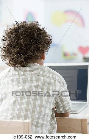 Rear view of a boy View Large Photo Image Stock Image - Rear view of a boy. Fotosearch