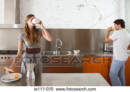 A couple ignoring each other at breakfast View Large Photo Image Stock Image - A couple ignoring each other at breakfast. Fotosearch