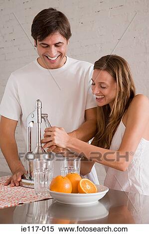 A couple making orange juice View Large Photo Image Stock Photography - A couple making orange juice. Fotosearch