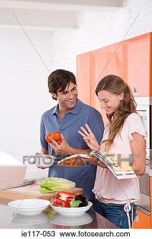A couple reading a cookbook View Large Photo Image Stock Image - A couple reading a cookbook. Fotosearch
