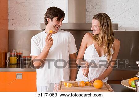 A couple slicing oranges View Large Photo Image Stock Image - A couple slicing oranges. Fotosearch