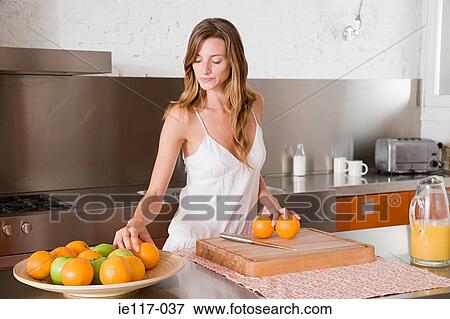 A woman making orange juice View Large Photo Image Stock Photo - A woman making orange juice. Fotosearch