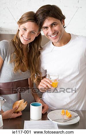 Portrait of a couple having breakfast View Large Photo Image Stock Image - Portrait of a couple having breakfast. Fotosearch