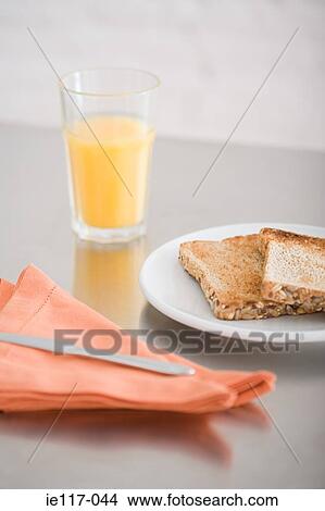 Toast and a glass of orange juice View Large Photo Image Picture - Toast and a glass of orange juice. Fotosearch
